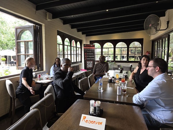 A group of people sitting at tables